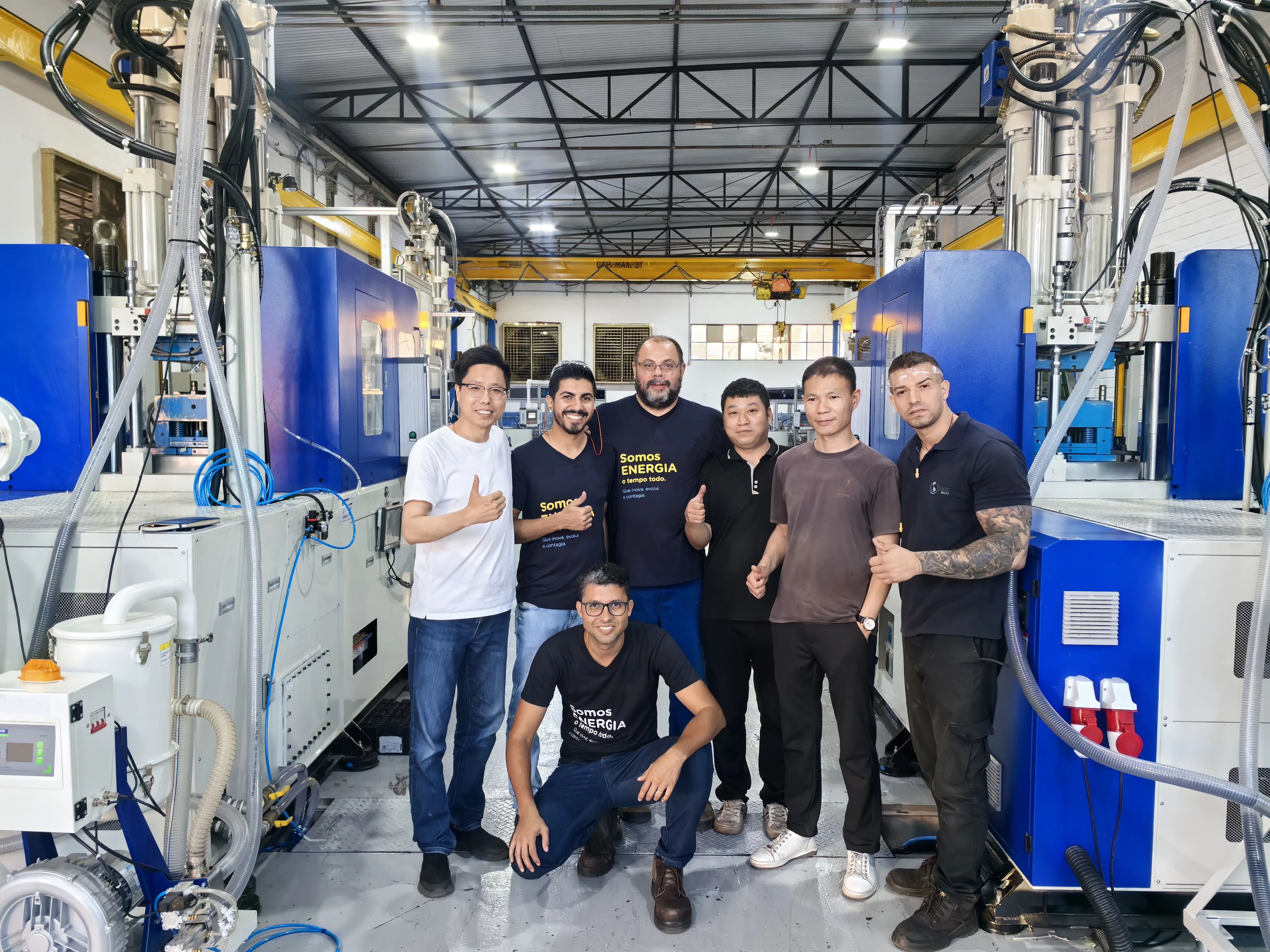 Deboge team with international customers at the factory, group photo