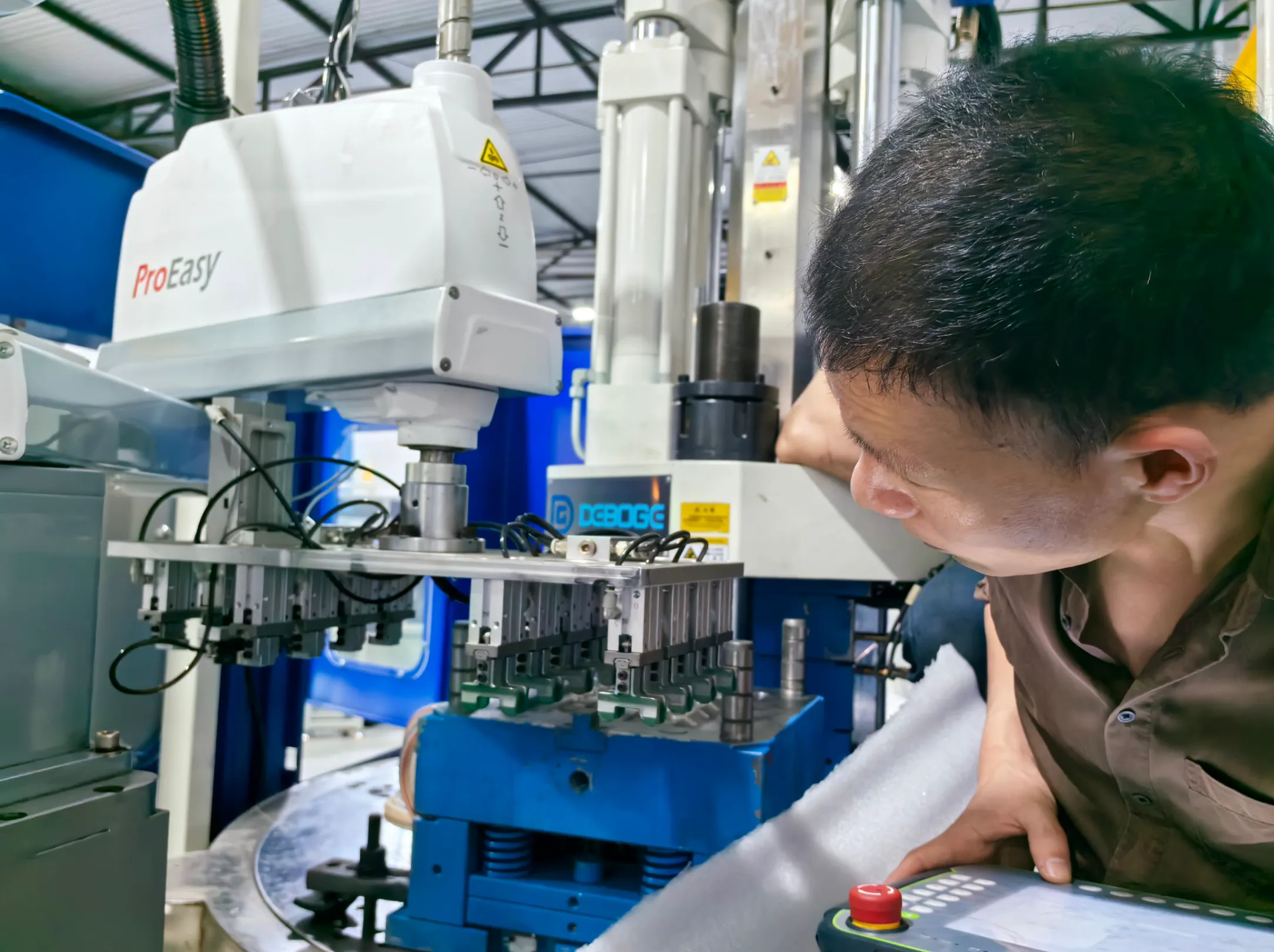 Deboge machine calibration and testing  - automation-ready vertical injection molding machine with control system