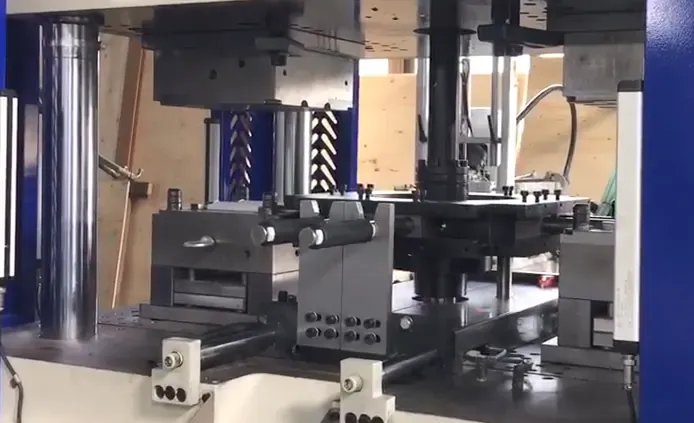 Side view of the rotary shaft and mold area used to transfer the handlebar grip between molding stages