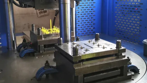 Rotary injection molding work area showing two lower mold positions for the animal ear tag project